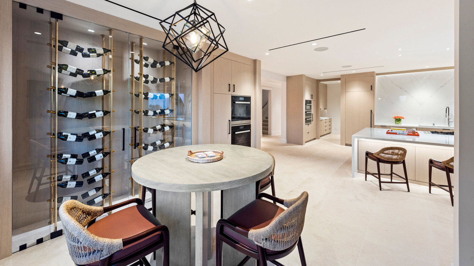 Kitchen dining area with brass wine display