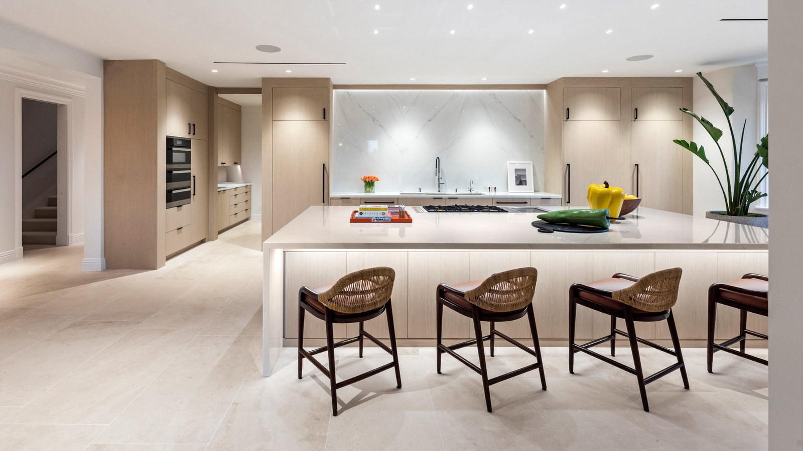 Custom kitchen with white oak cabinetry and marble