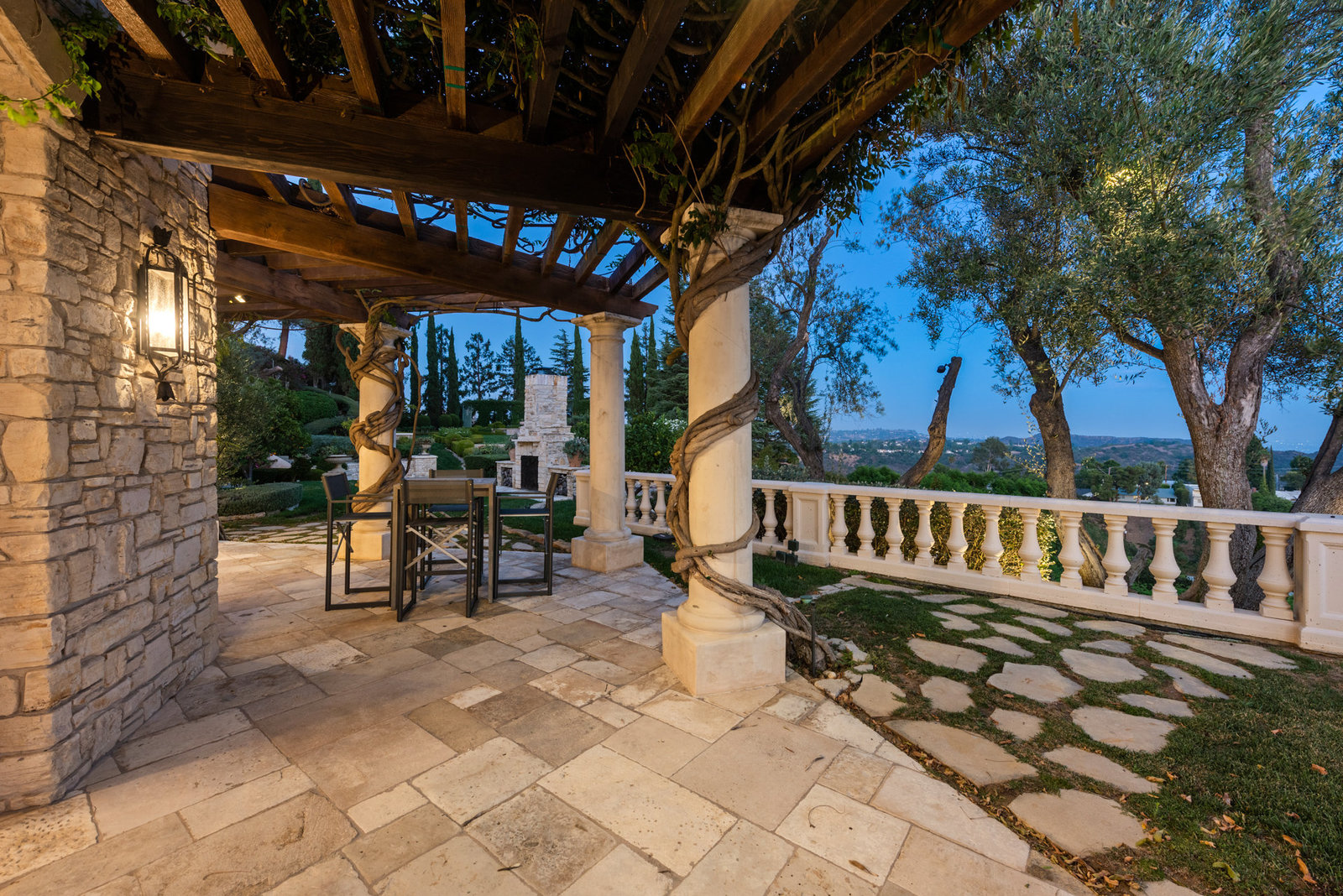 Guest terrace with stone loggia and canyon views