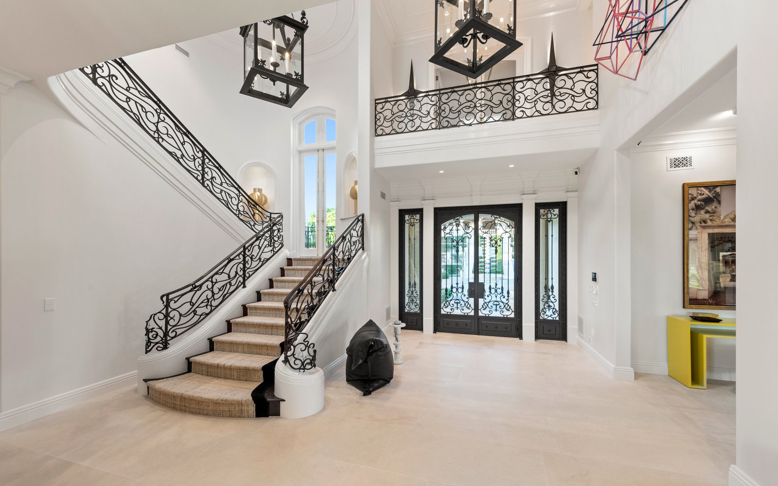 Formal entry hall with wrought iron stair