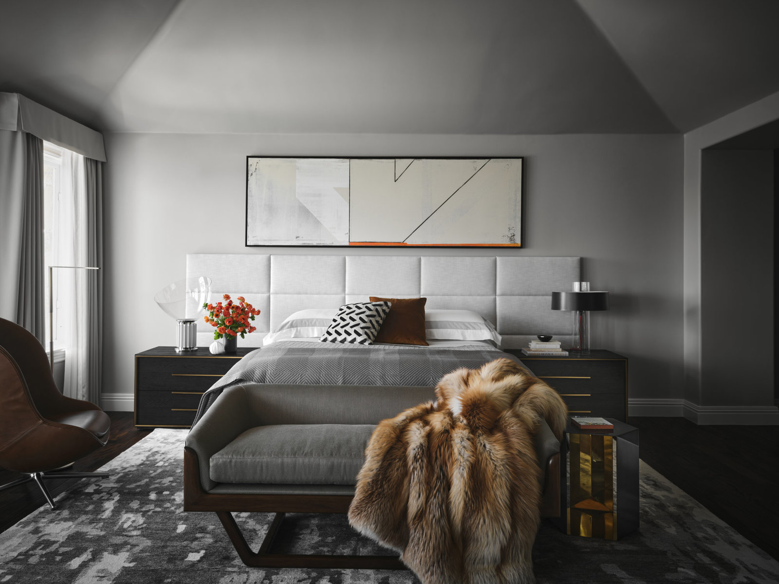 Moody bedroom suite with contemporary art